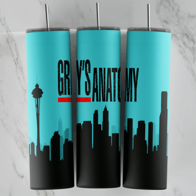 A Grey’s Anatomy tumbler wrap in turquoise with the show title in black and red and a black Seattle skyline silhouette. Sublimation design