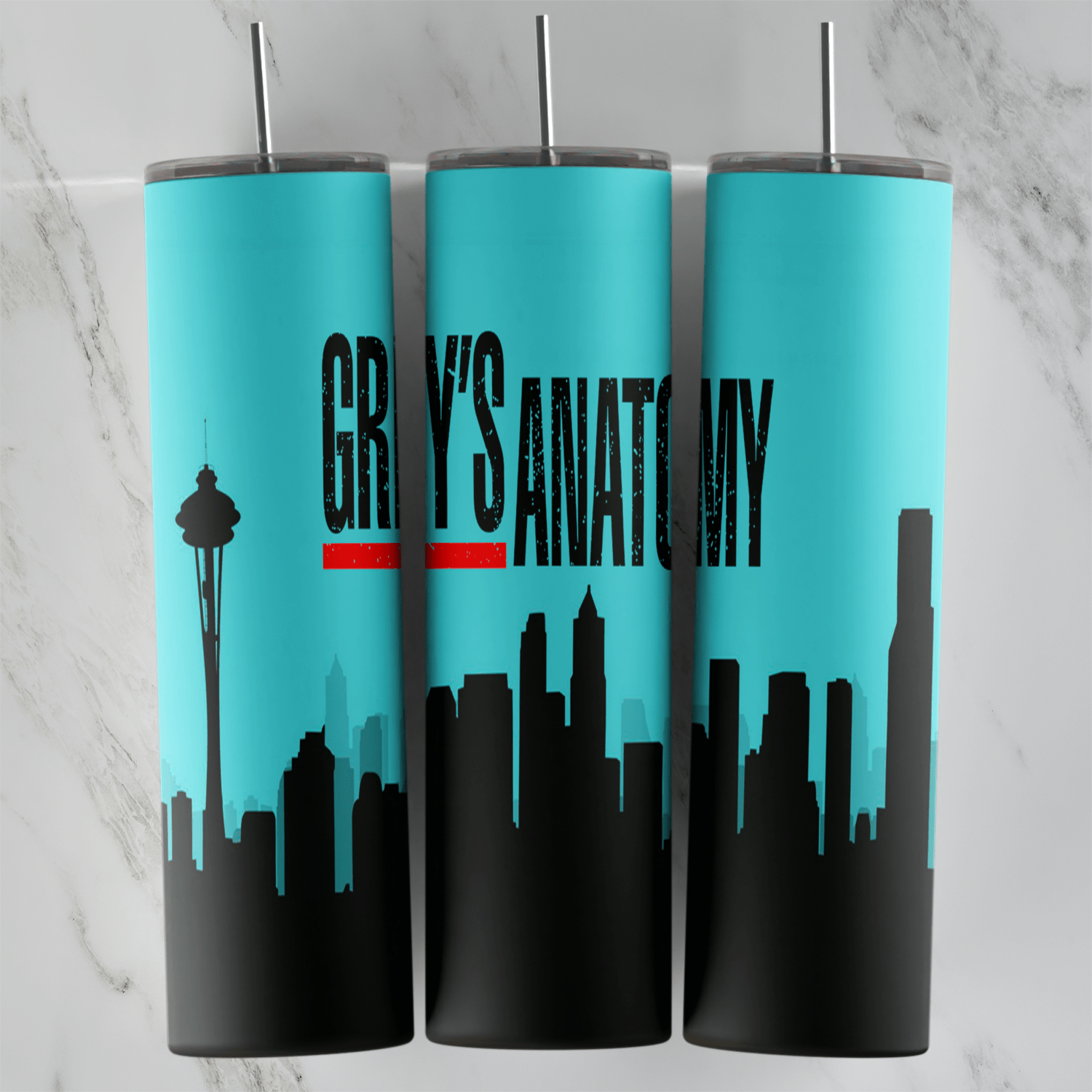 A Grey’s Anatomy tumbler wrap in turquoise with the show title in black and red and a black Seattle skyline silhouette. Sublimation design