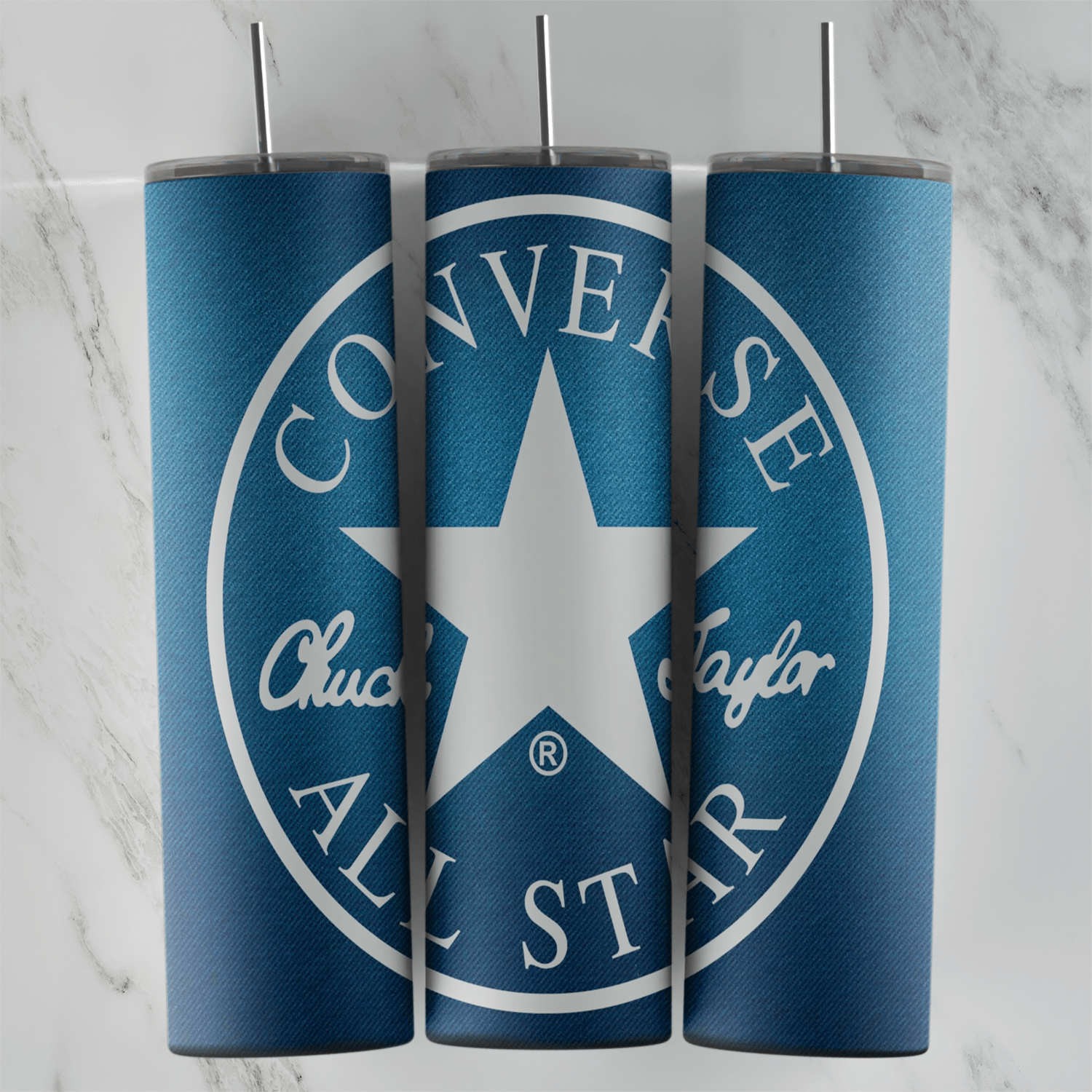 A full 20 oz skinny tumbler wrap in blue with a large round Converse Chuck Taylor All Star logo and a white star in the center. Sublimation design