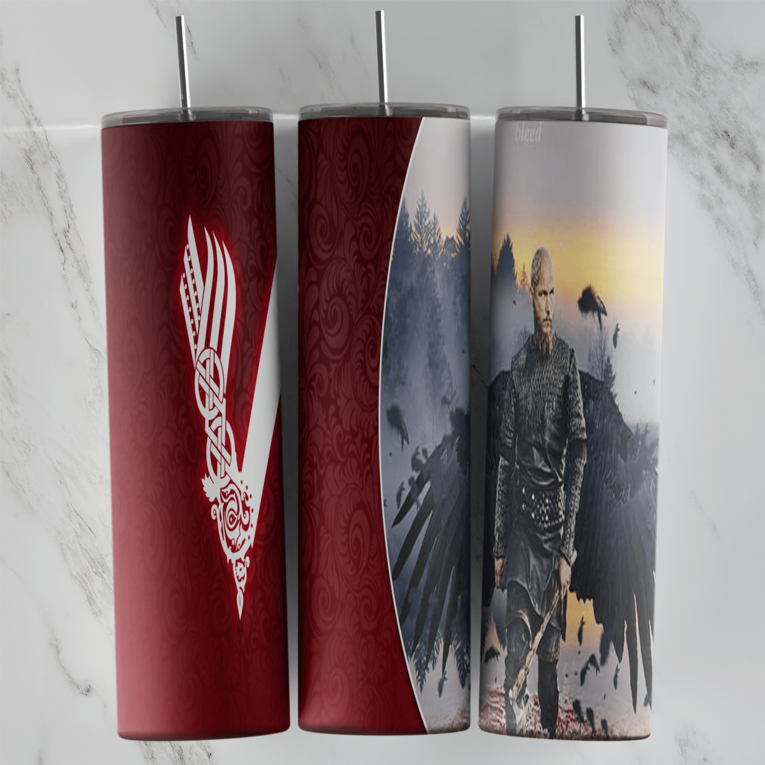 A 20 oz skinny tumbler wrap with the white Vikings V logo on dark red and a warrior standing with large dark raven wings behind. Sublimation design
