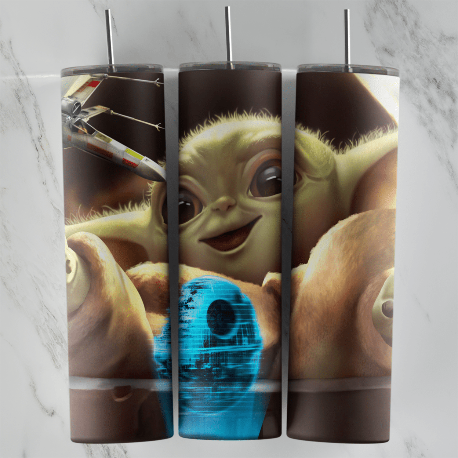 A full 20 oz skinny tumbler wrap with a close up of a smiling Baby Yoda, Grogu, holding a blue Death Star toy, with an X-wing. Sublimation design