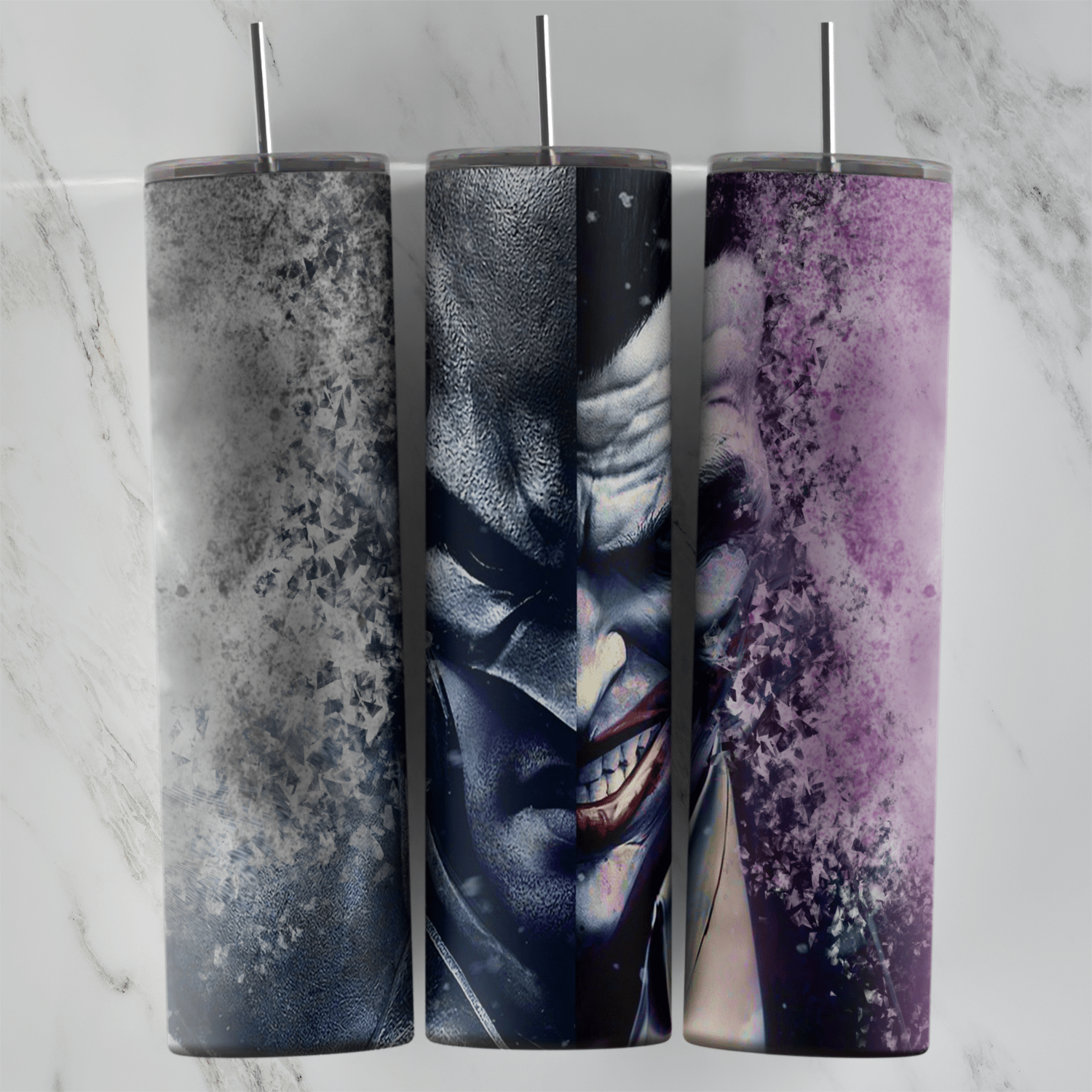 A 20 oz tumbler wrap with a painted split face, half Batman and half the grinning Joker, fading into gray and purple ink splatter. Sublimation design