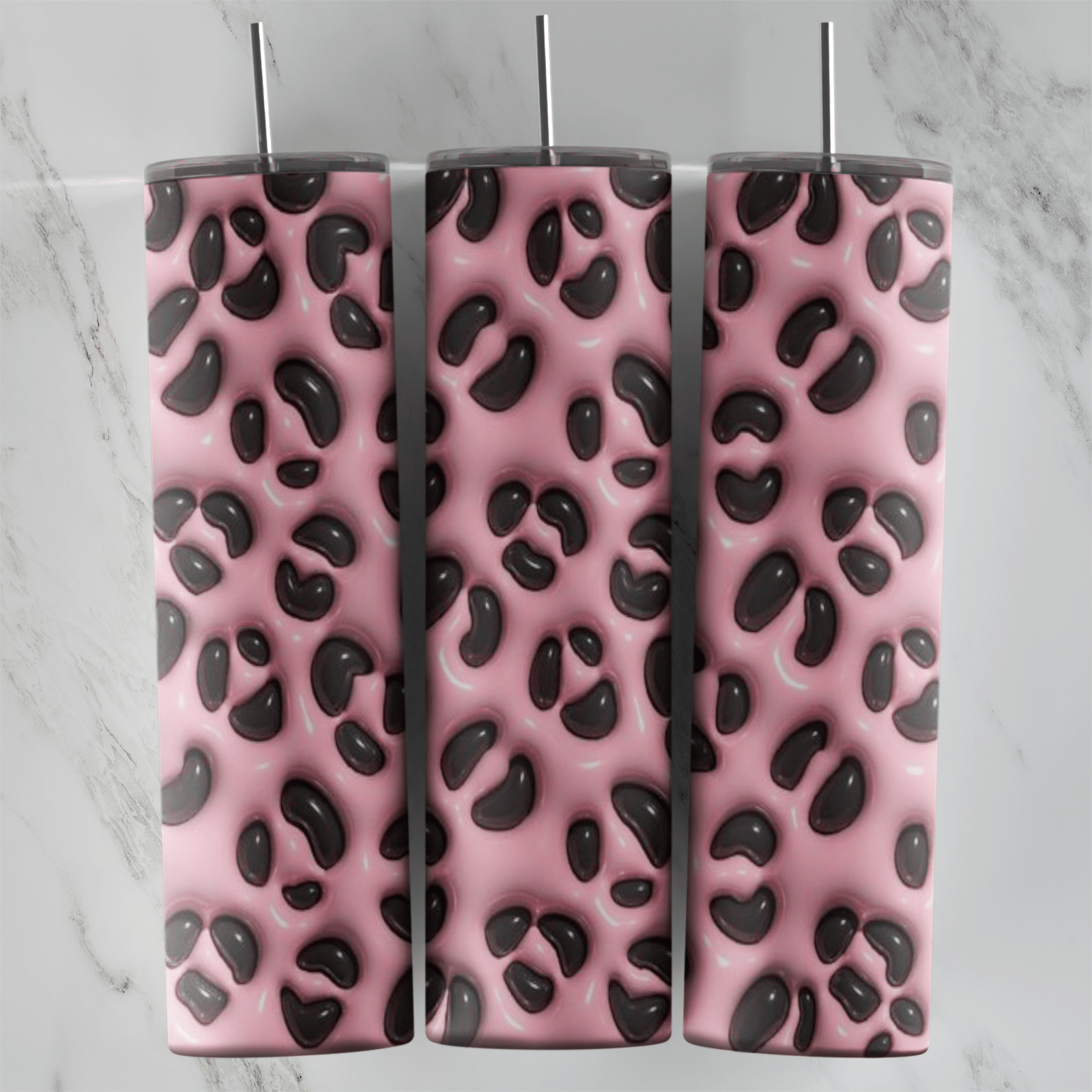 A full 20 oz skinny tumbler wrap in puffy 3D inflated style with a pink leopard print pattern of raised dark brown spots. Sublimation design
