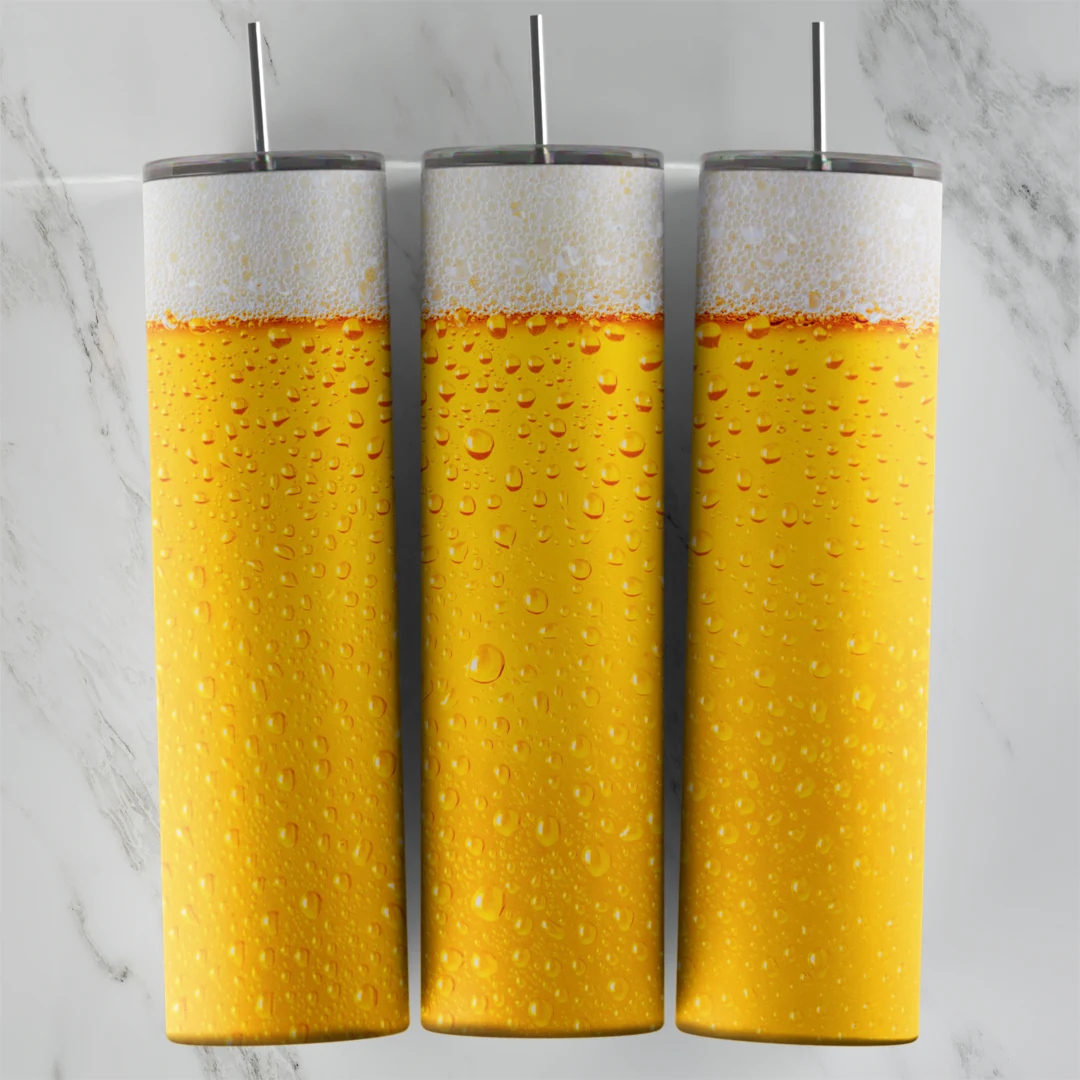 A 20 oz skinny tumbler wrap that looks like golden beer filling the cup, with a white foam band and water drops across the surface. Sublimation design